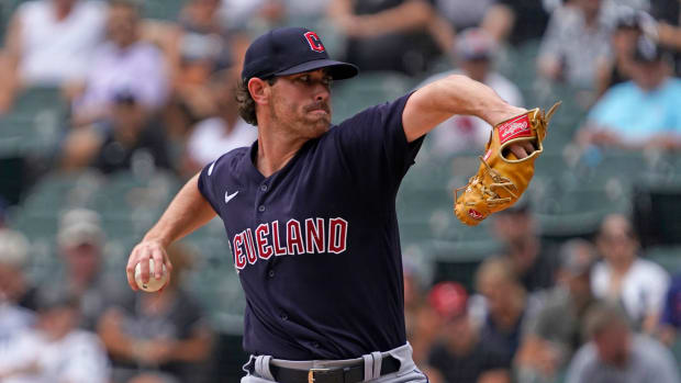 Caption: Jul 24, 2022; Chicago, Illinois, USA; Cleveland Guardians starting pitcher Shane Bieber (57) throws the ball against the Chicago White Sox during the first inning at Guaranteed Rate Field. Mandatory Credit: David Banks-USA TODAY Sports